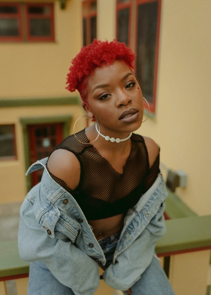 woman with red hair wearing mesh shirt - summer fashion in barbados