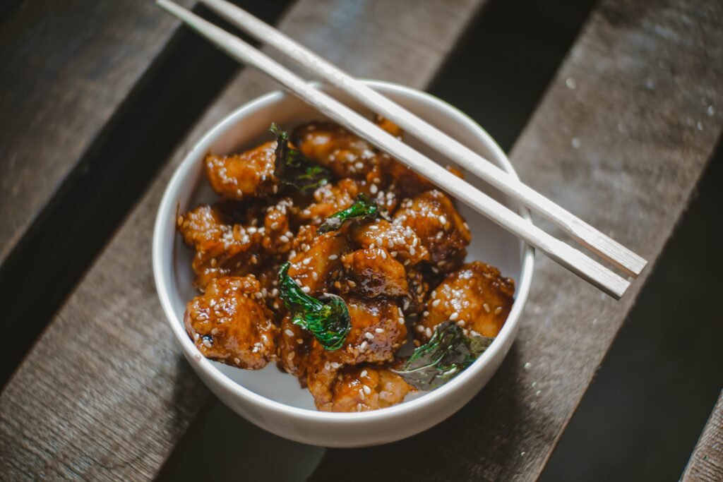 pieces of chicken covered in black  bean sauce